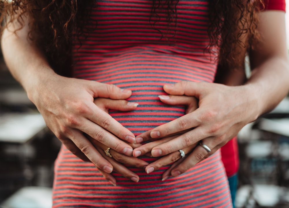 preganant woman holding tummy