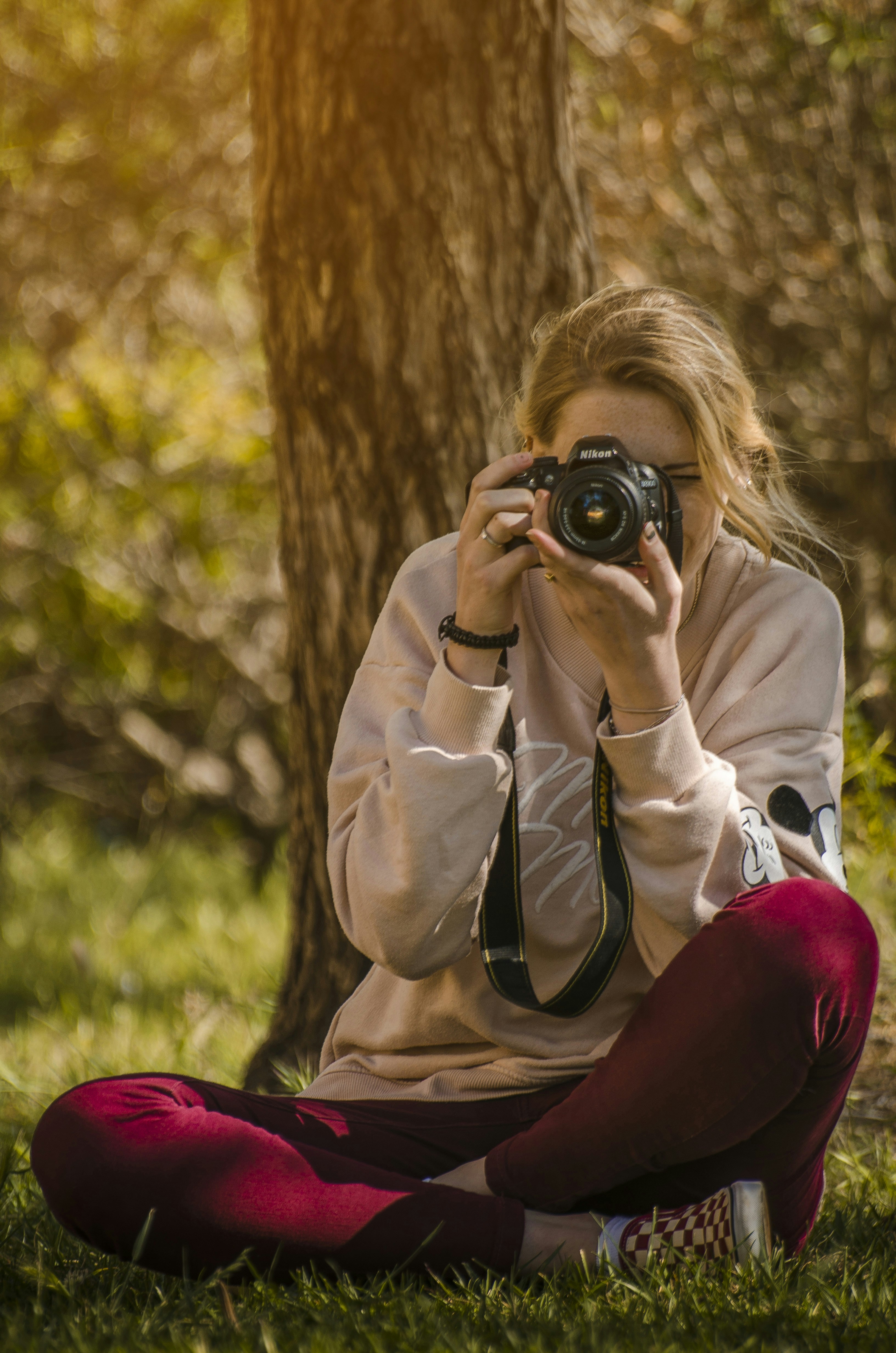 woman taking a photo during daytime