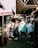 A cheerful group of friends shopping together in a vibrant market.