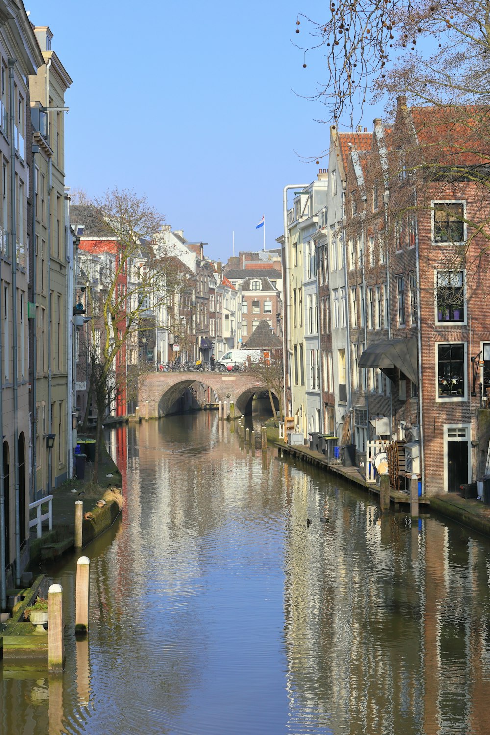 a river running through a city next to tall buildings