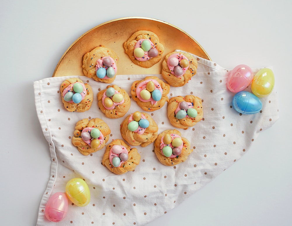 a plate of cookies and candy on a table