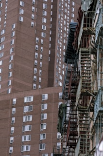 Before and after shots of a renovated residential building in a city neighborhood