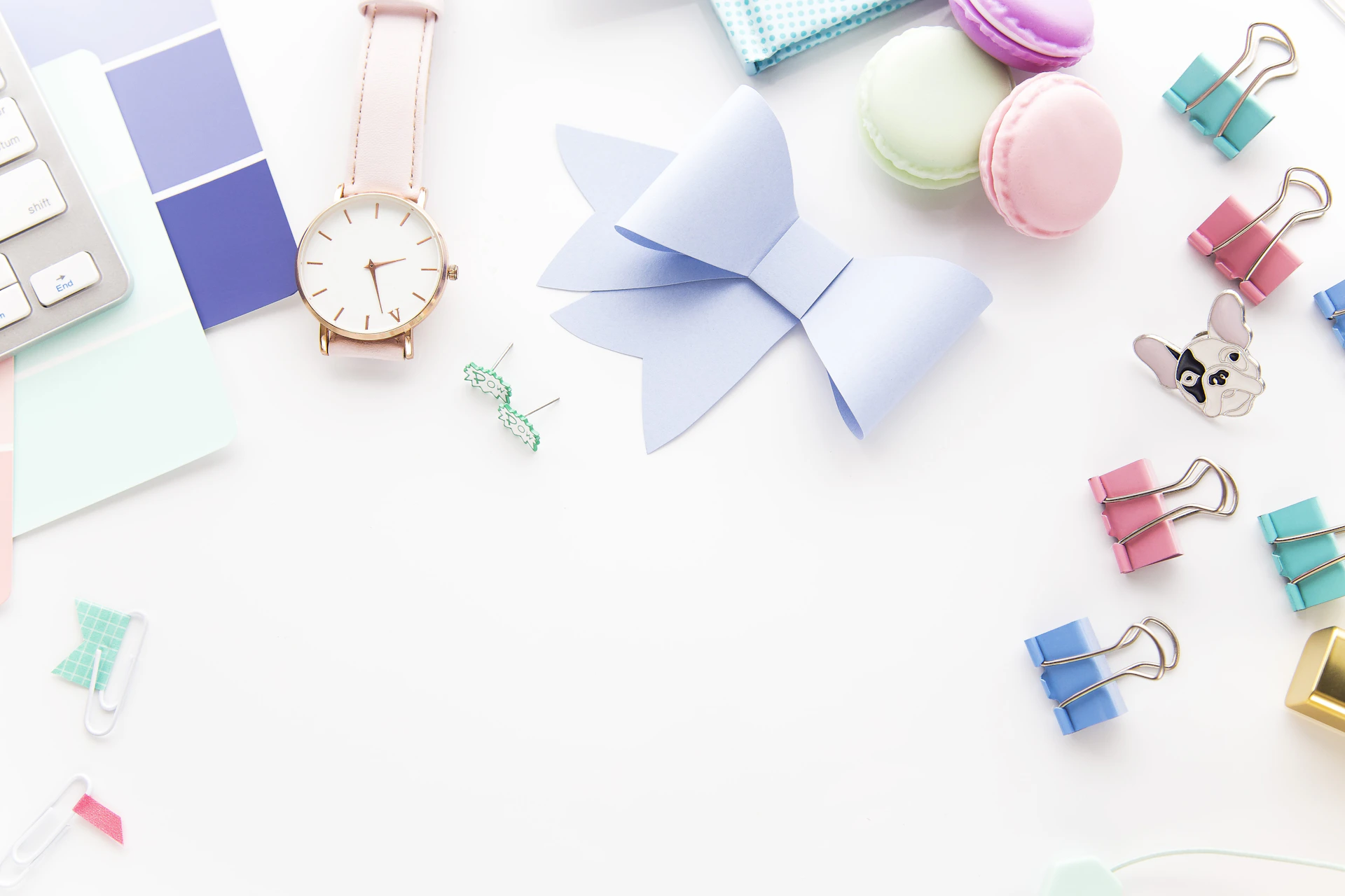 round white and gold-colored analog watch beside paper ribbon