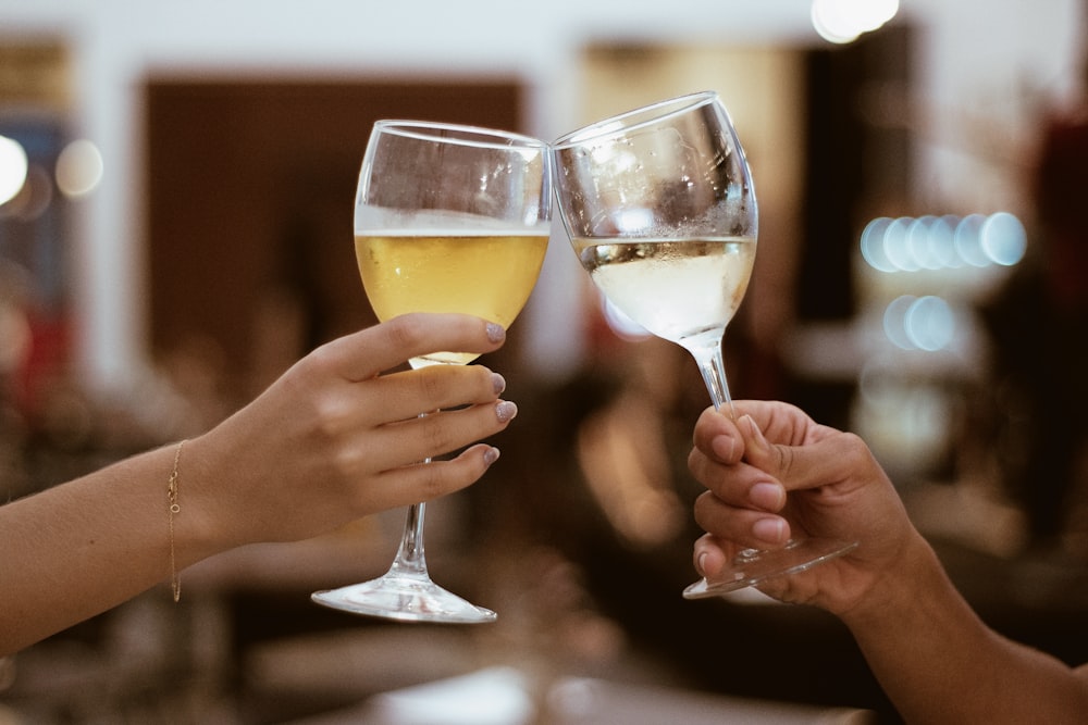 Two person toasting with wine glasses photo – Free Glass Image on Unsplash