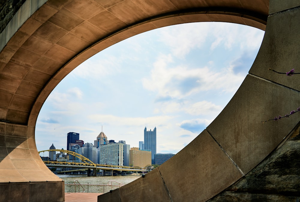 a view of a city from under a bridge