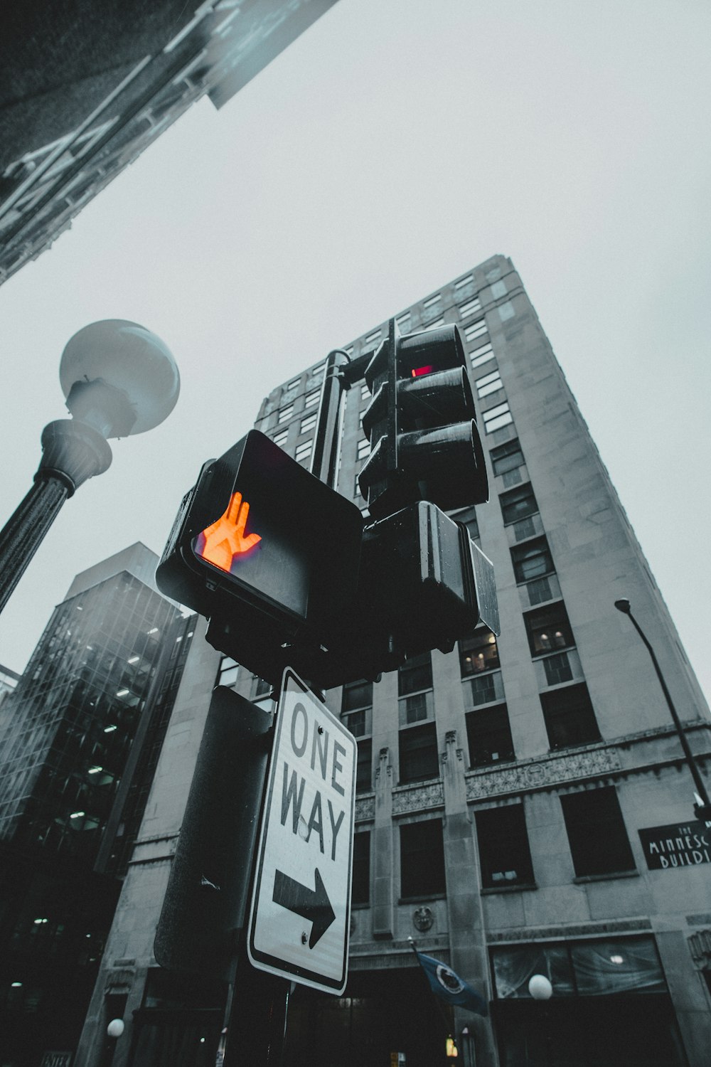 traffic light on stop beside lamp post