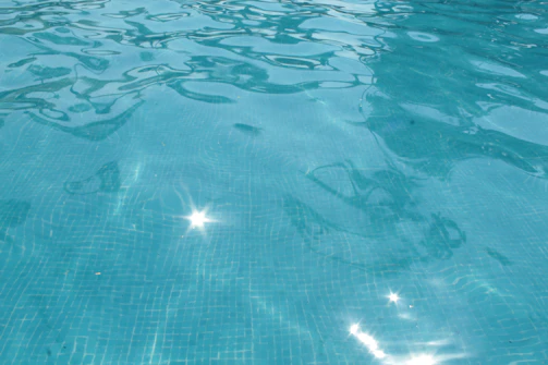 A sparkling in-ground pool after a thorough pressure test and repair.