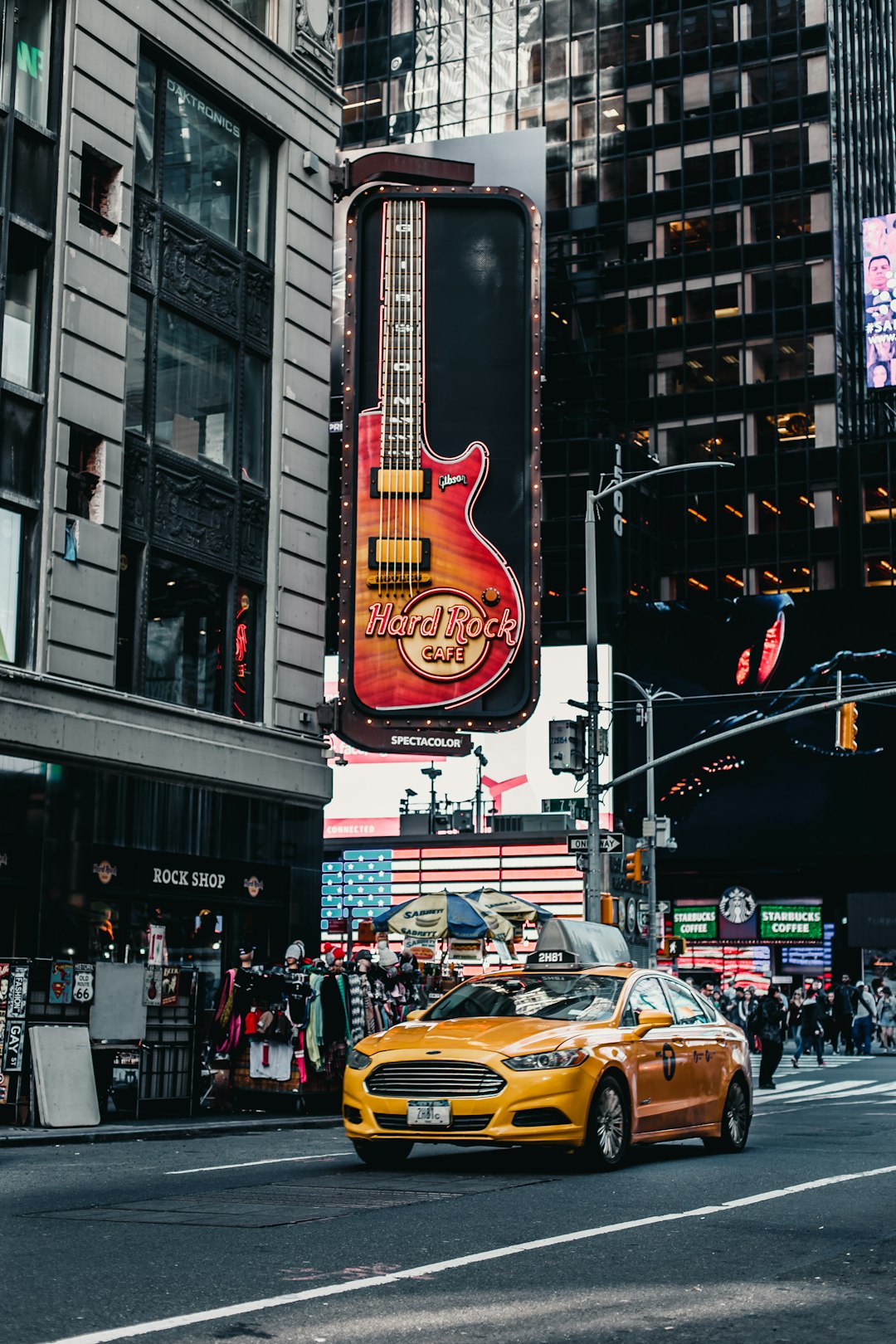 yellow sedan beside building