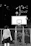 A dynamic photo of a professional basketball player mid-dunk with city lights in the background.