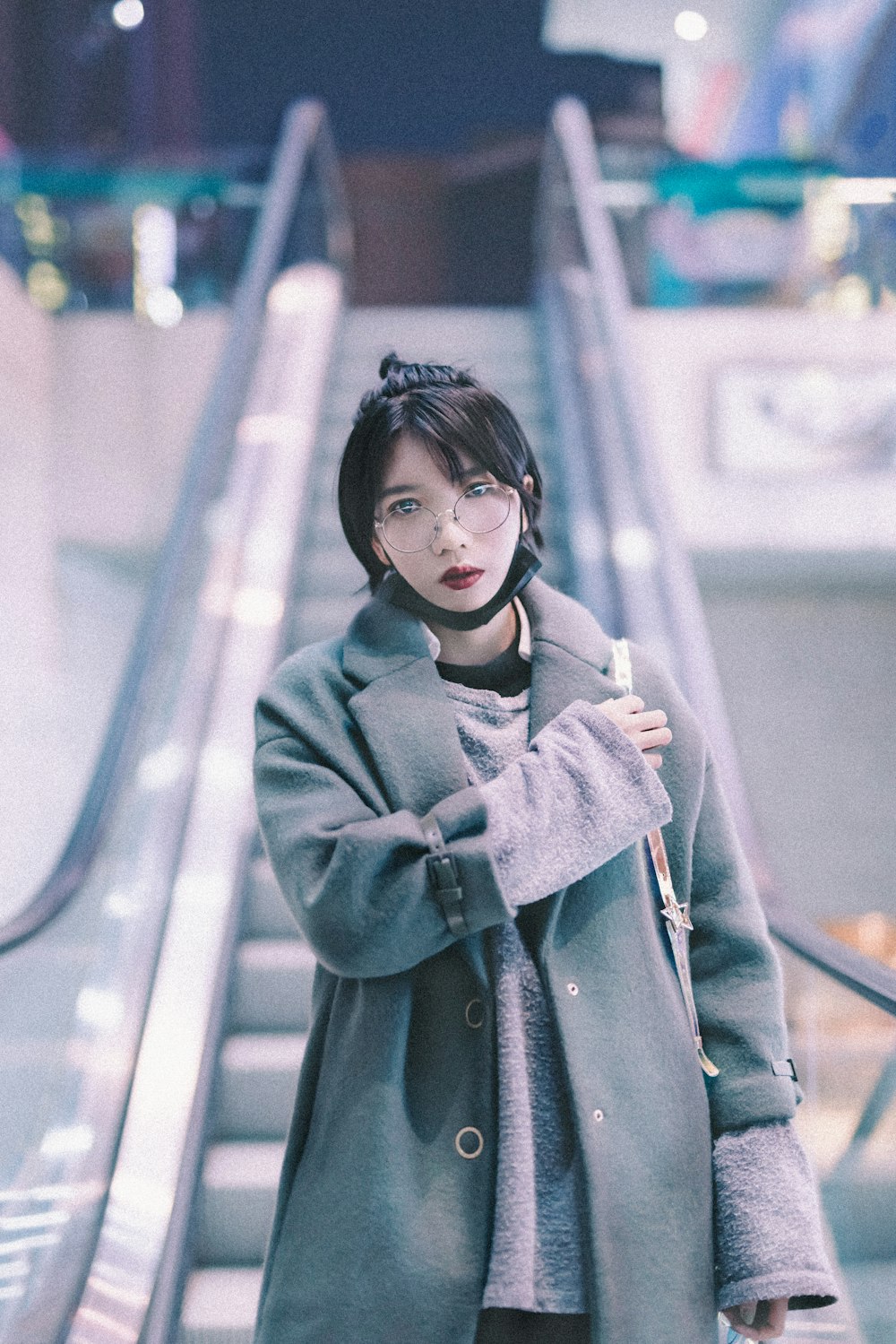 shallow focus photo of woman in gray coat