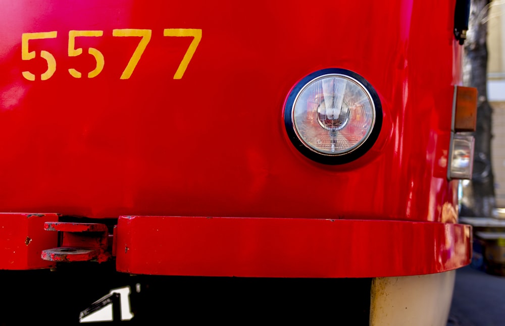 a close up of the front of a red truck