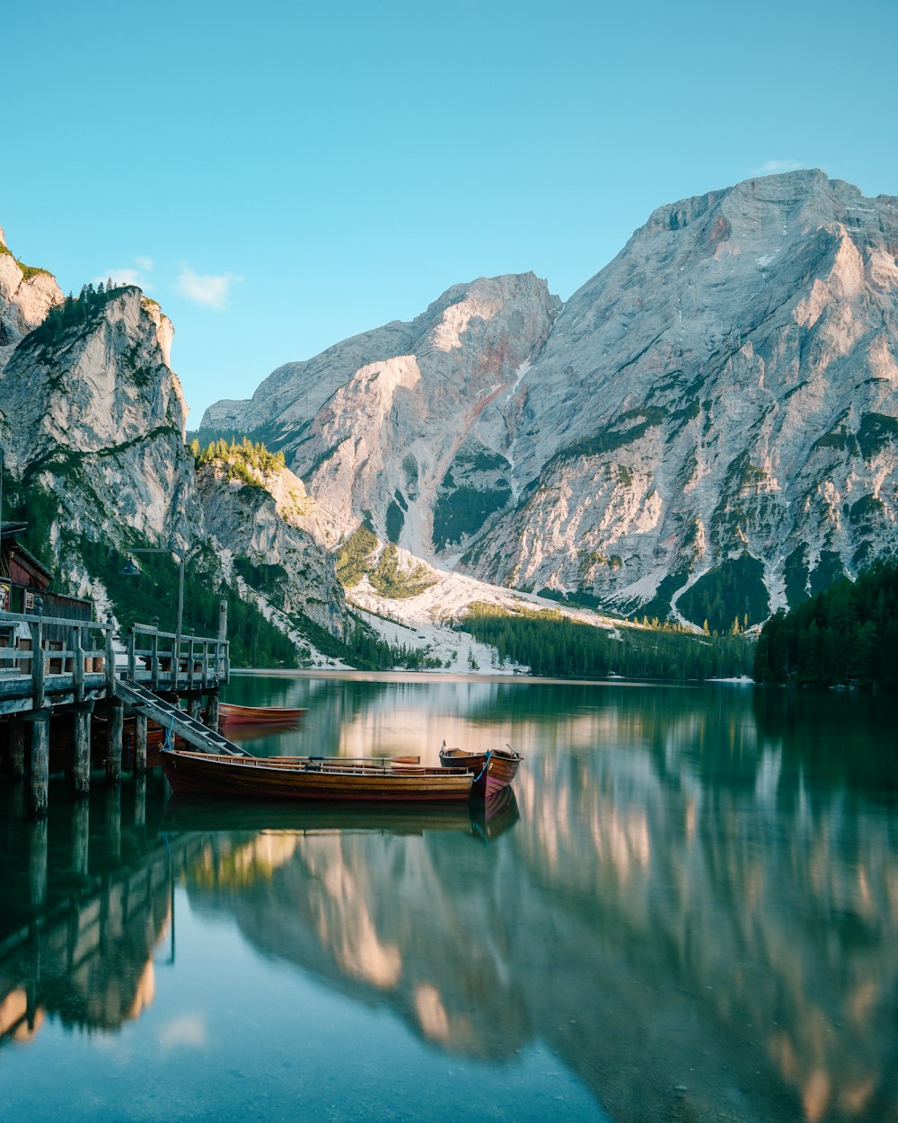 brown boat on body of water