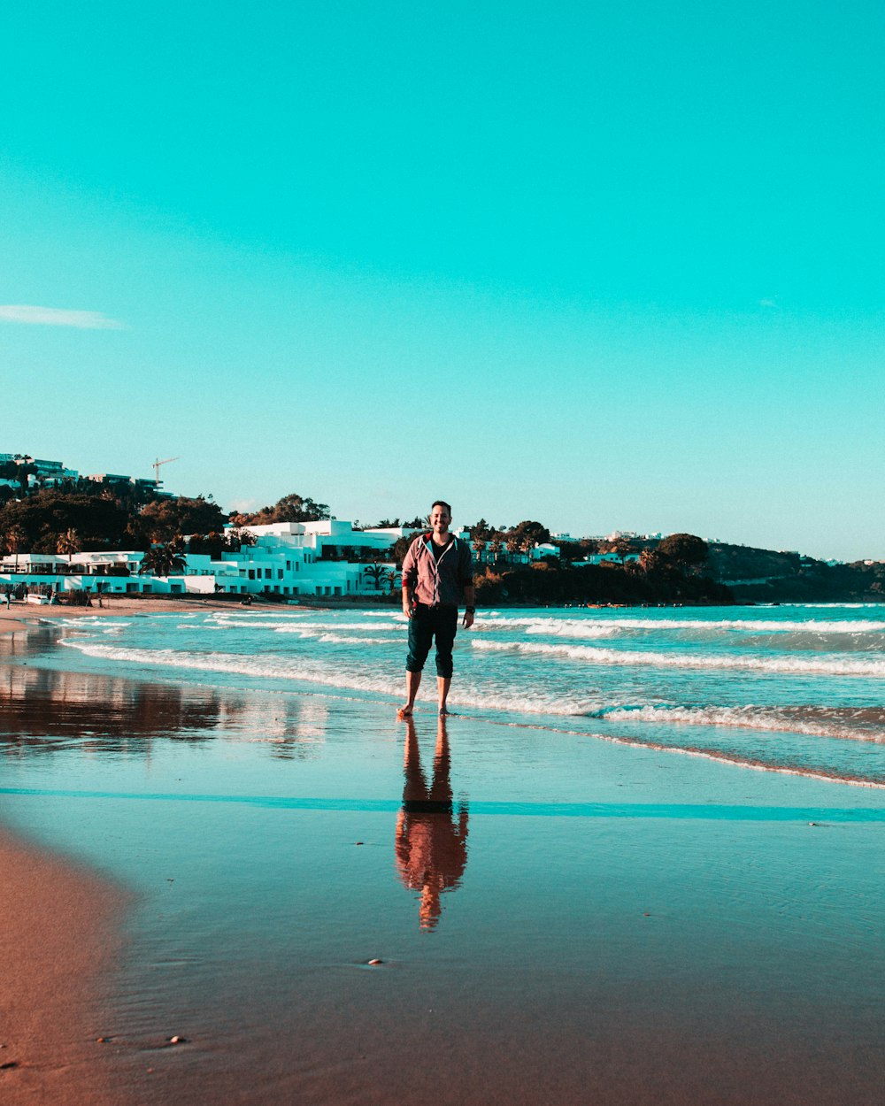 person standing on shoreline