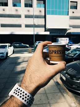 A drone delivering coffee in an urban setting.