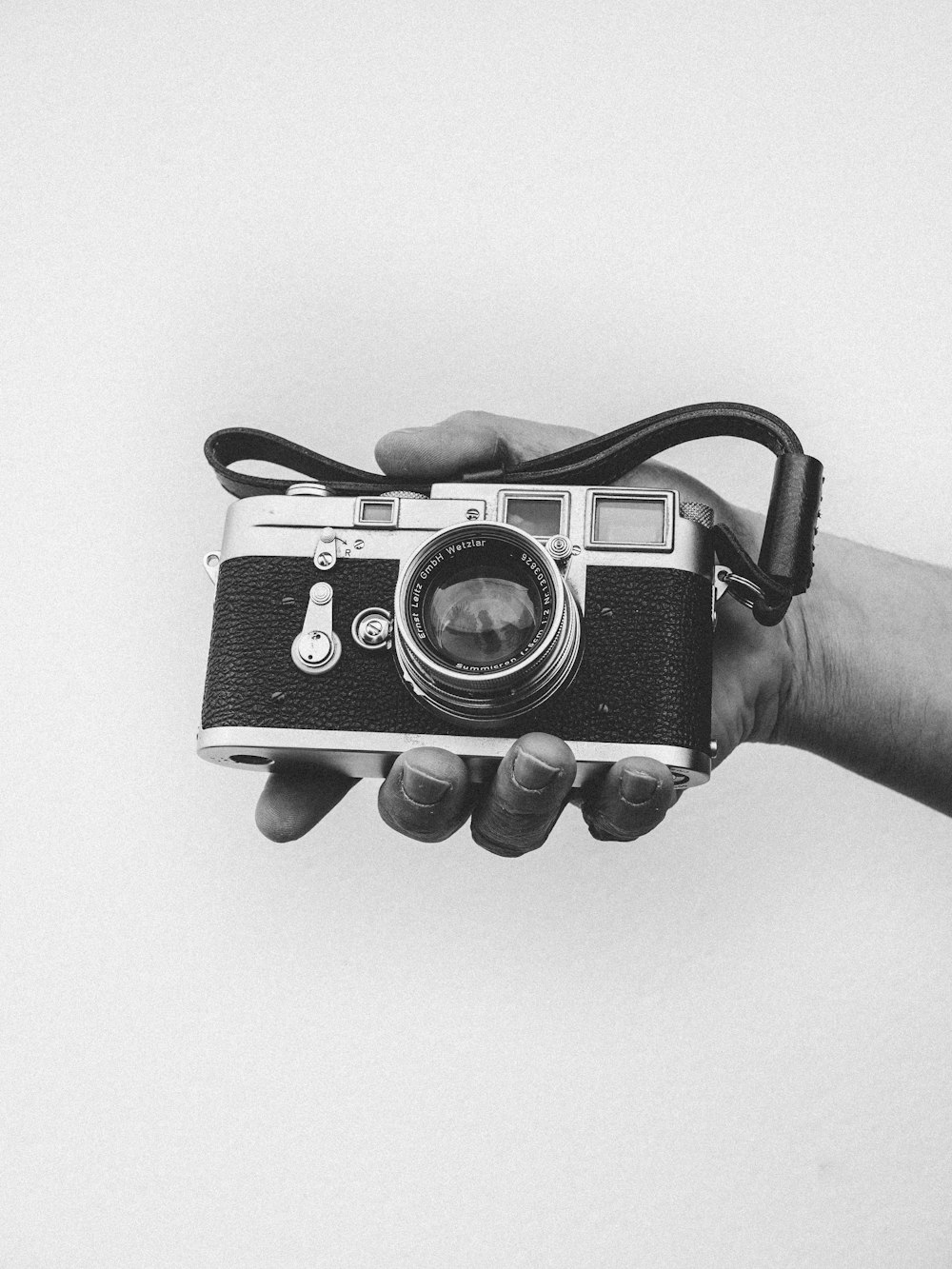 person holding black camera