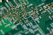 Close-up of electronic circuit boards and components neatly arranged on a workbench.