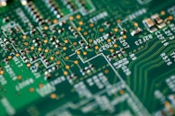 Close-up of a circuit board with intricate electronic components and soldering details.