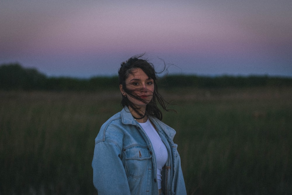 woman standing on brown field