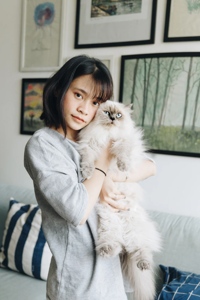 Person with cat at home