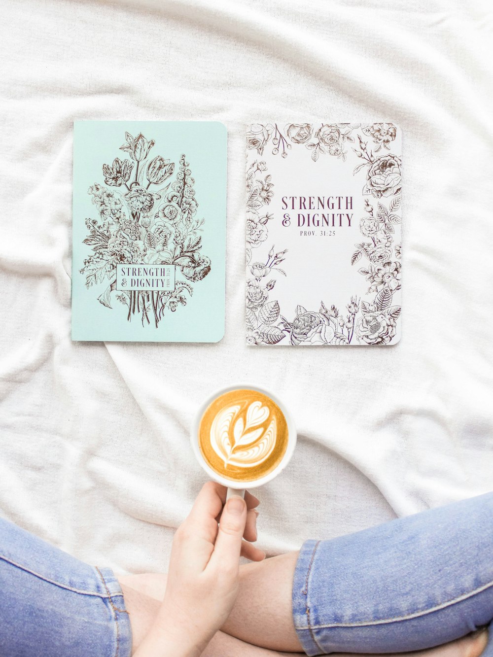 flat lay photography of white teacup near white and blue cards