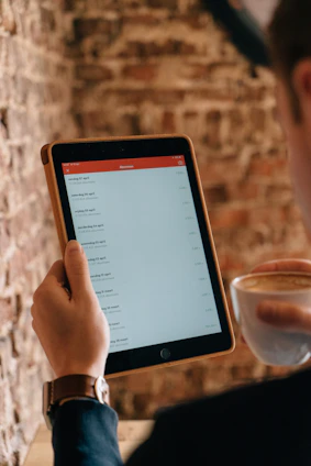 A colorful to-do list app interface on a smartphone surrounded by coffee beans.