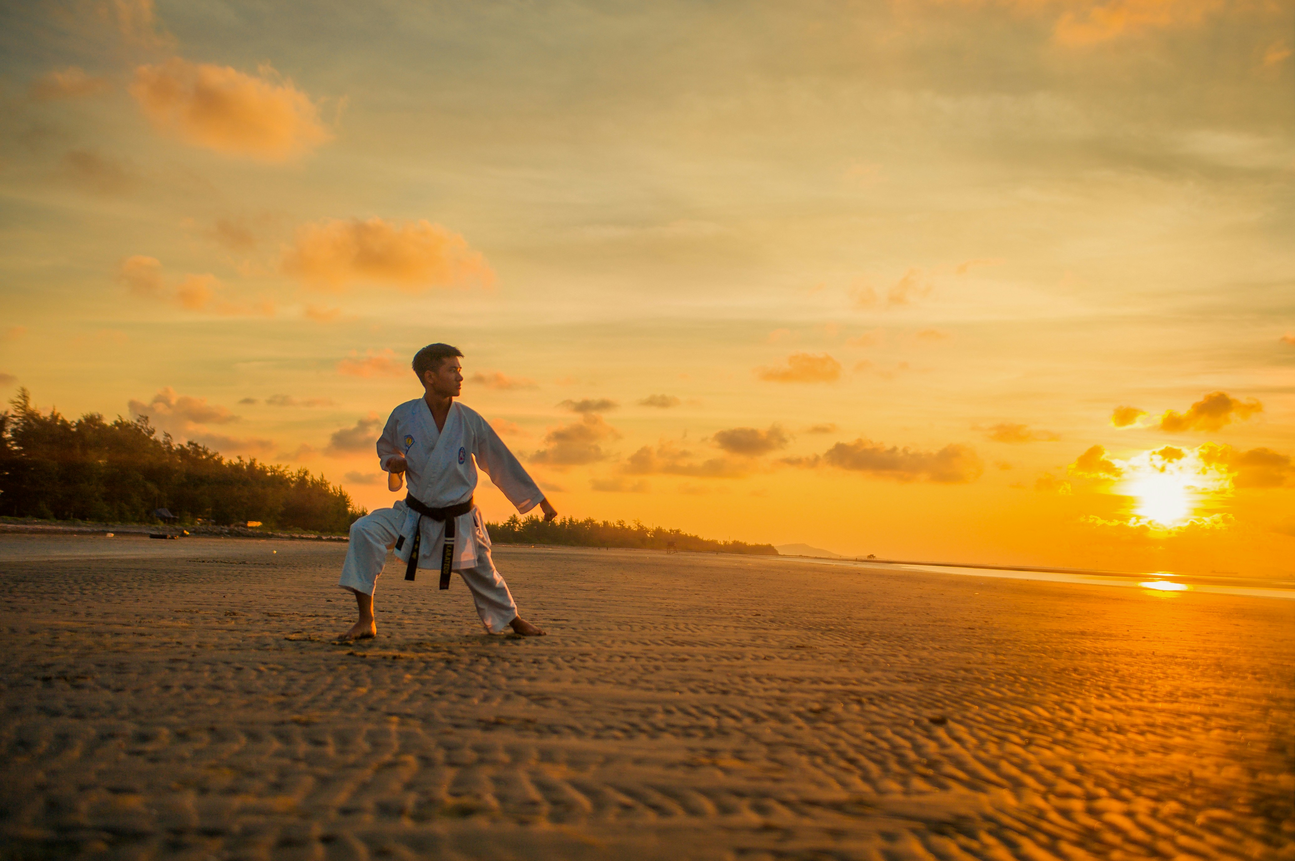 Man practicing karate in the sunset