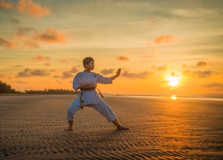 boy doing karate routines during golden hour