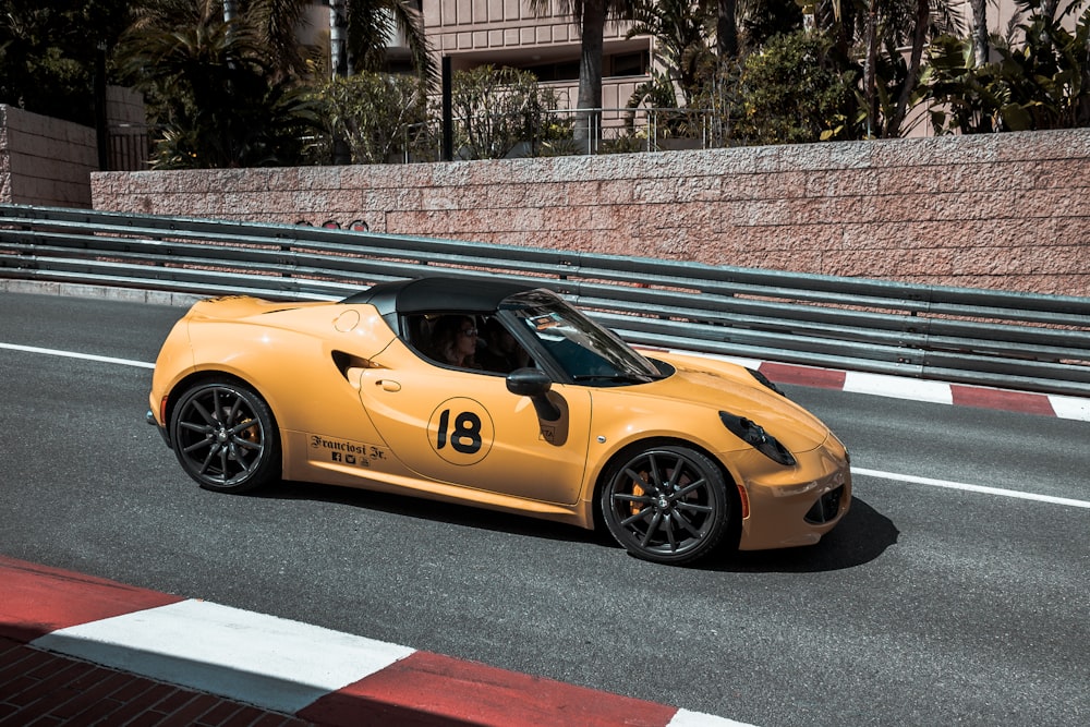 yellow convertible on street