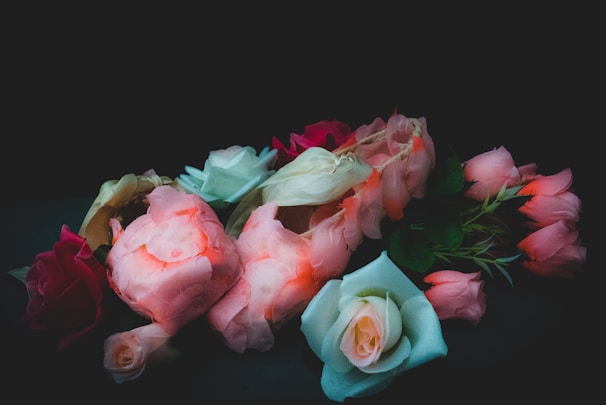 A stunning arrangement of assorted colored roses.