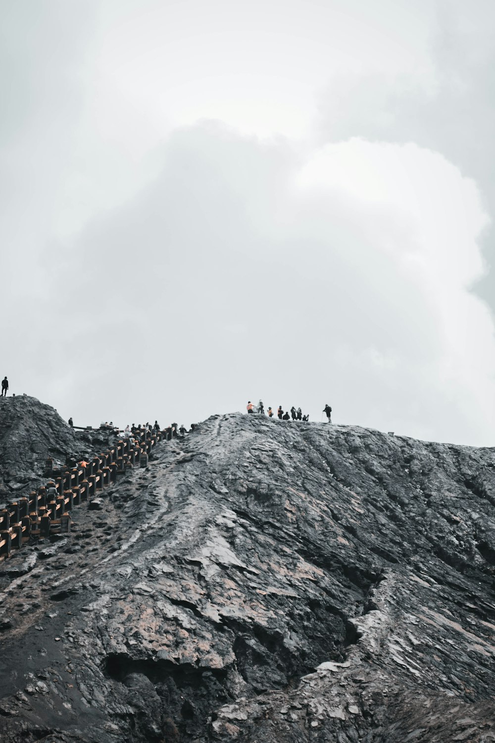 people standing on hill