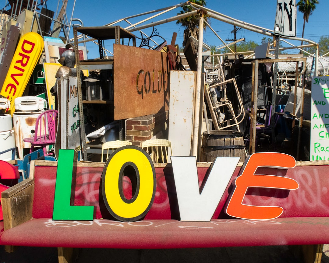 cut out love letters on red bench