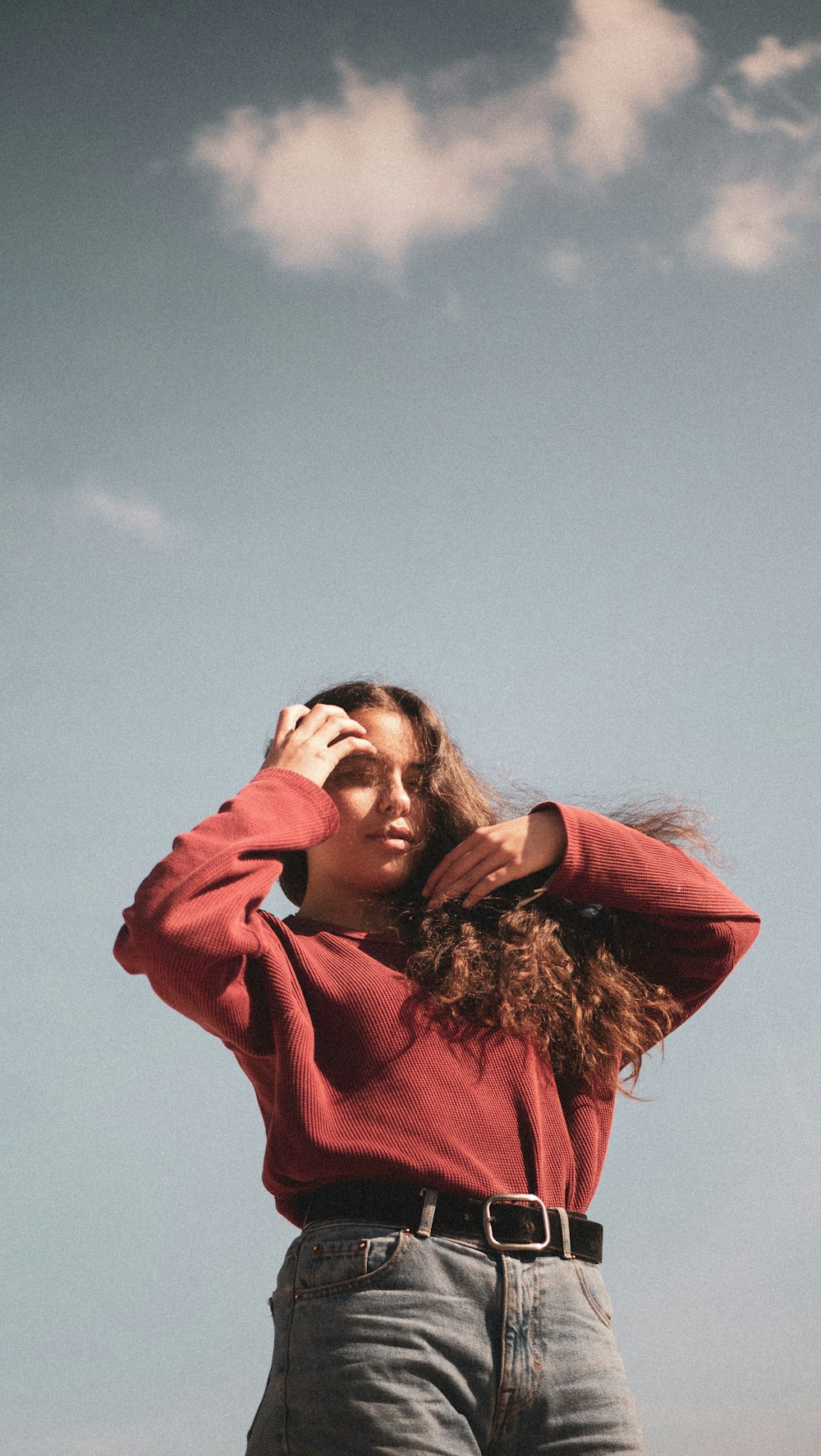 woman wearing maroon sweater