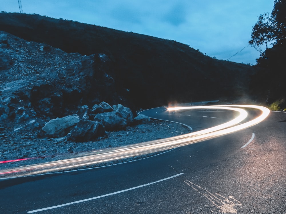 lighted light on road during nighttime