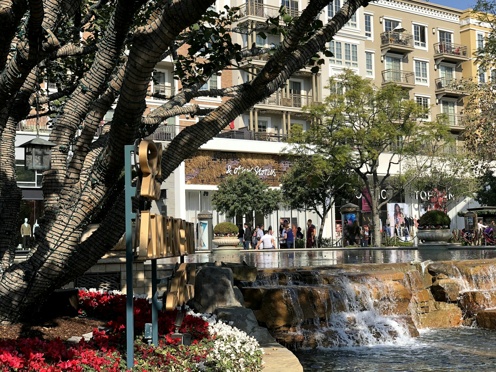 woman wearing yellow long-sleeved dress under white clouds and blue sky during daytime