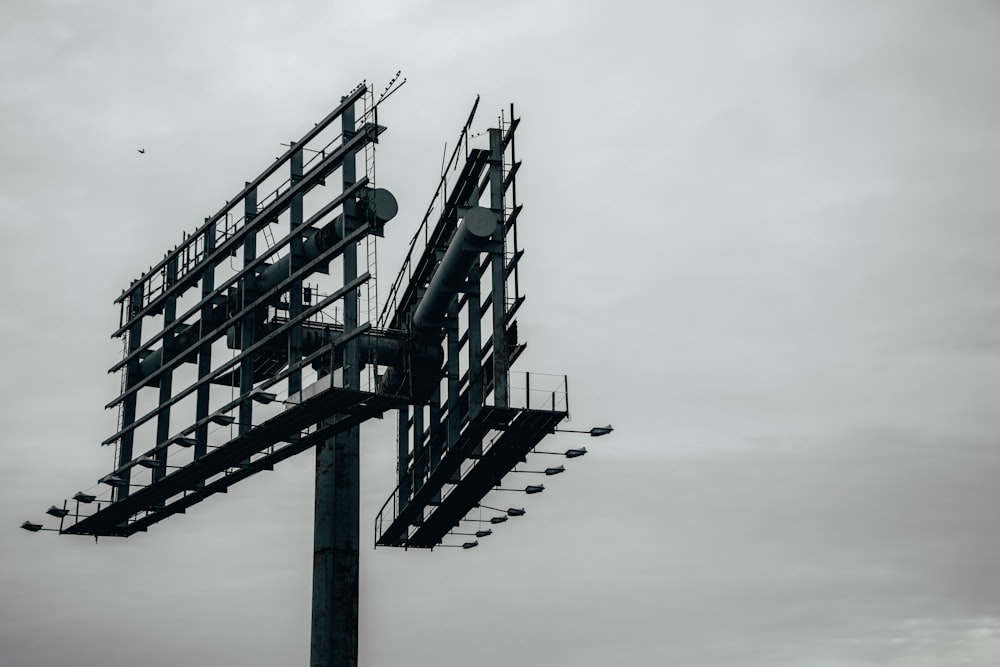 grayscale photography of metal billboard