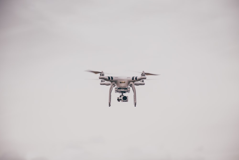 white DJI Phantom drone at mid air