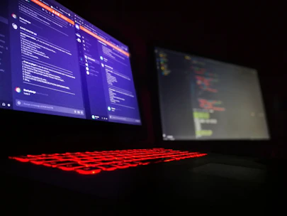 Close-up of a developer integrating an API for secure messaging on a laptop.