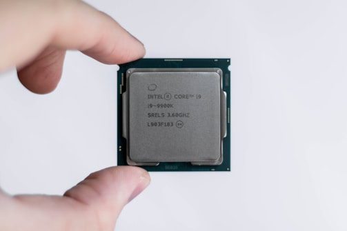 person holding Intel processor