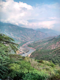 river flows between mountains