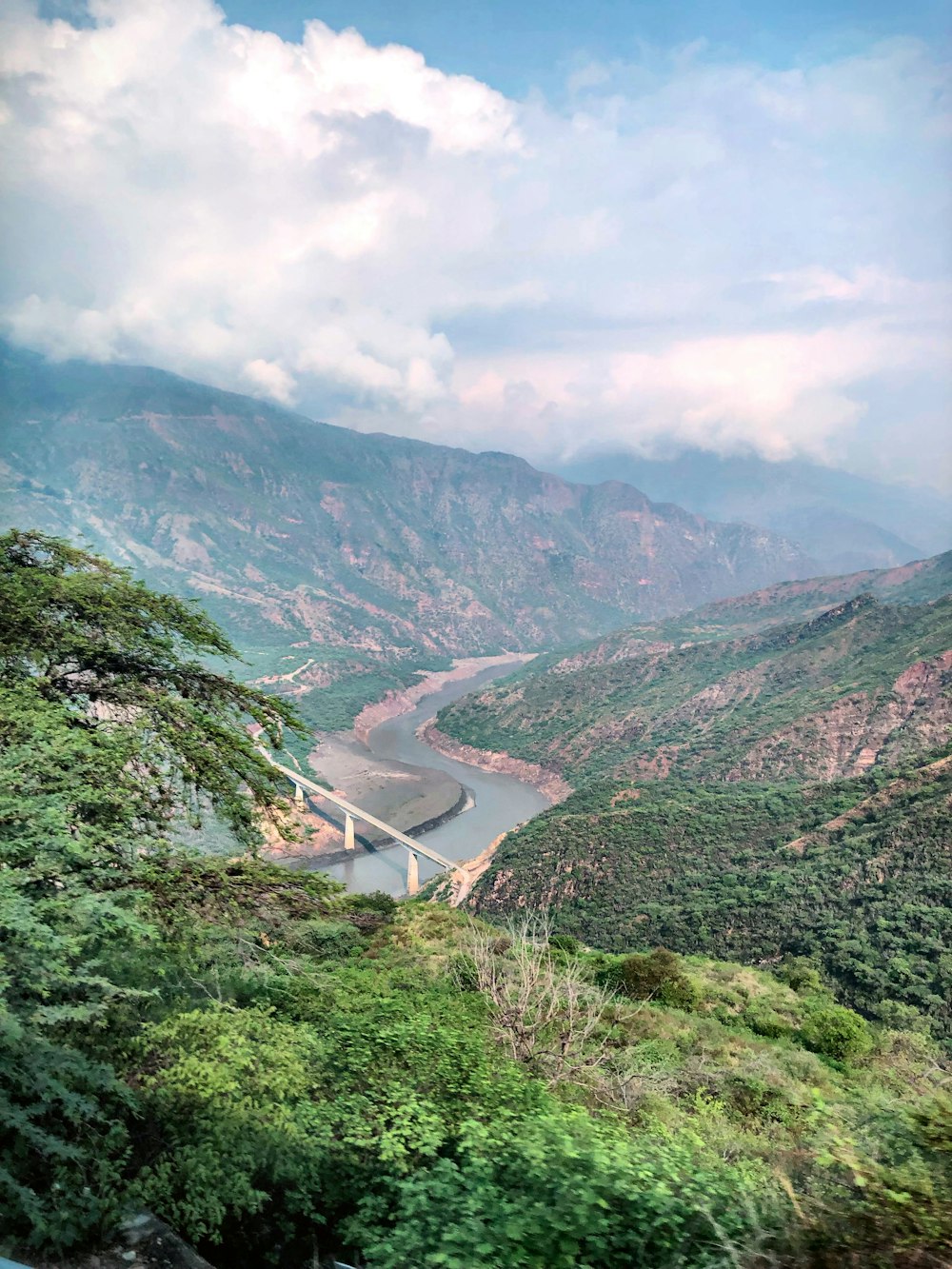 river flows between mountains