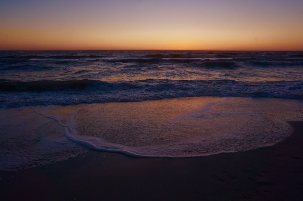 sea waves during golden hour