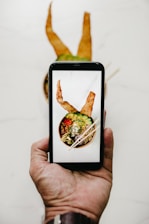person holding black smartphone