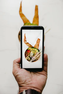 person holding black smartphone