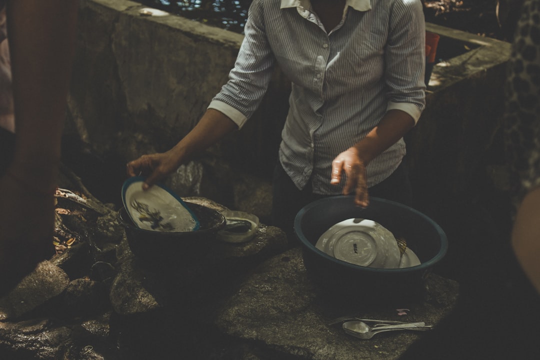 person washing dishes