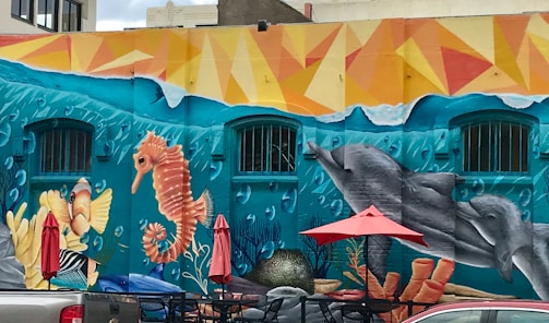 Colorful coral and aqua sea animal murals creating an inspiring, comforting atmosphere for children.