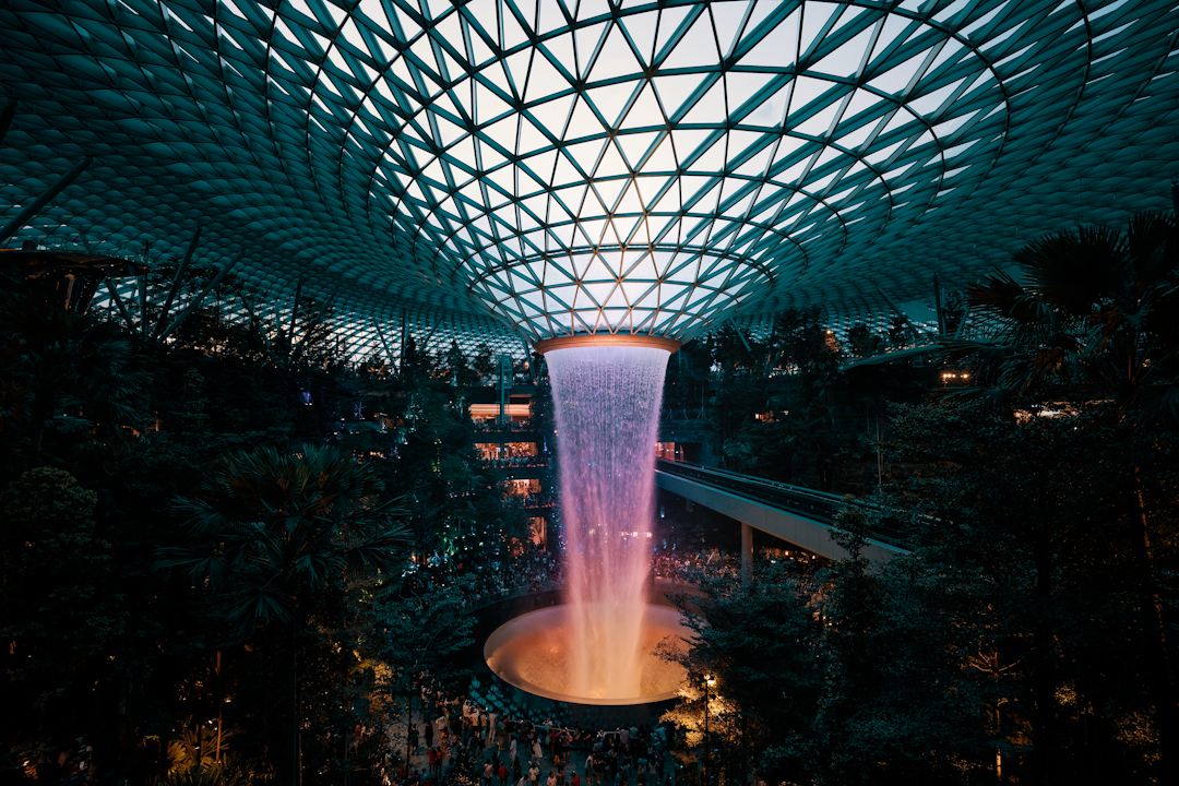 a large fountain in the middle of a building, World Tallest indoor Waterfall