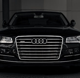 a black and white photo of an audi car