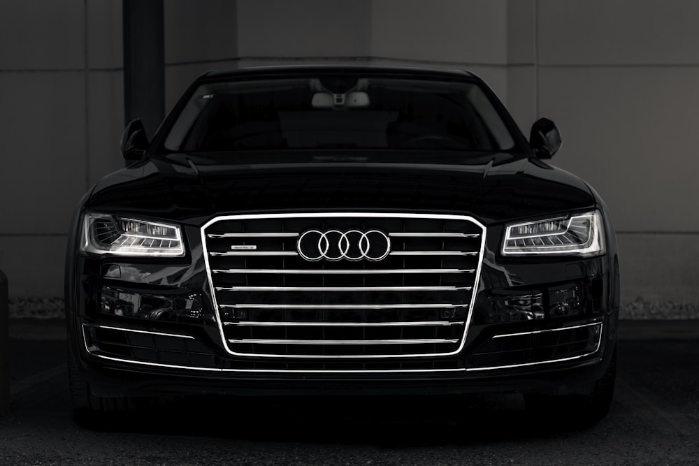 a black and white photo of an audi car