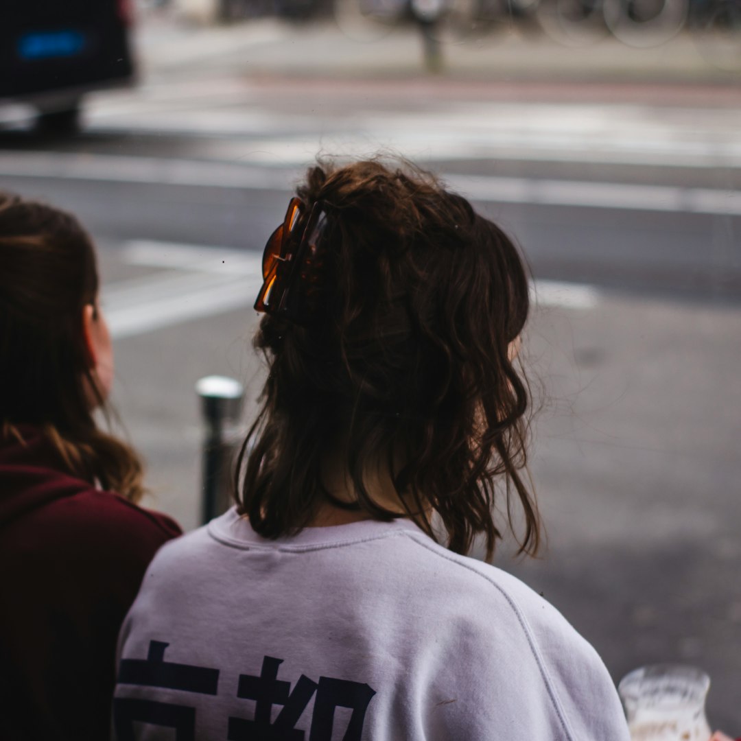 shallow focus photo of person in white top