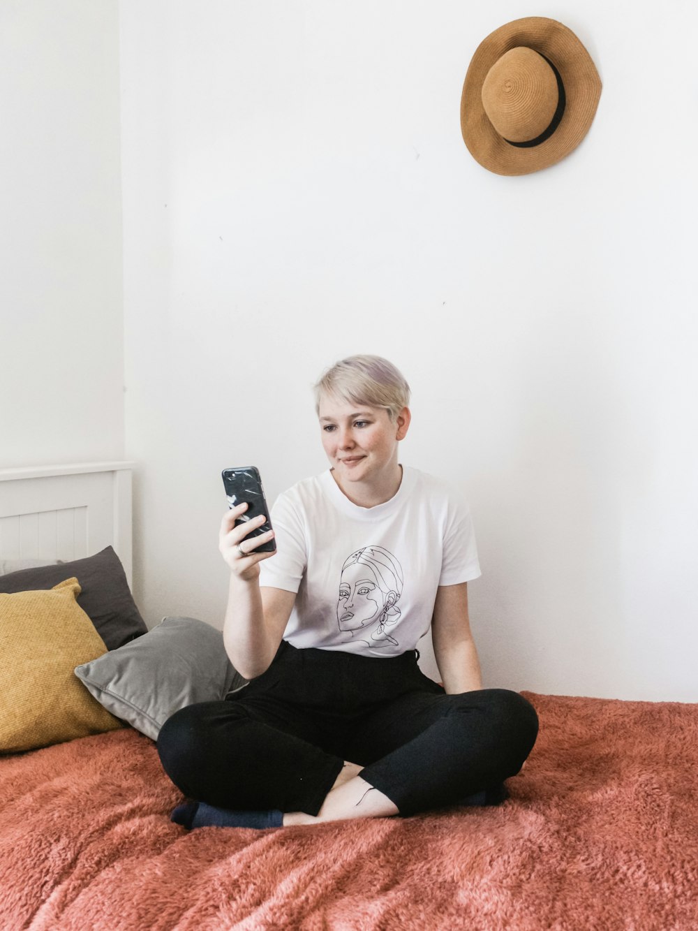 woman sitting on bed